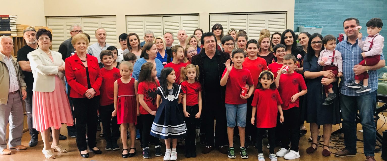 Vatra Tampa Bay families and children gathered in red and black at a community meeting